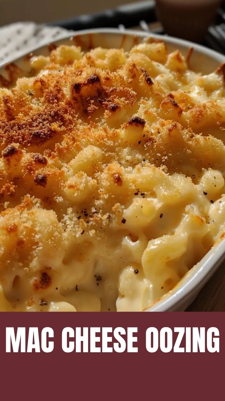 A close-up of a bubbling, golden-brown baked mac and cheese casserole, fresh from the oven.