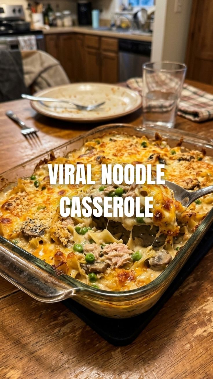 A bubbling dish of classic tuna noodle casserole with a golden-brown topping.