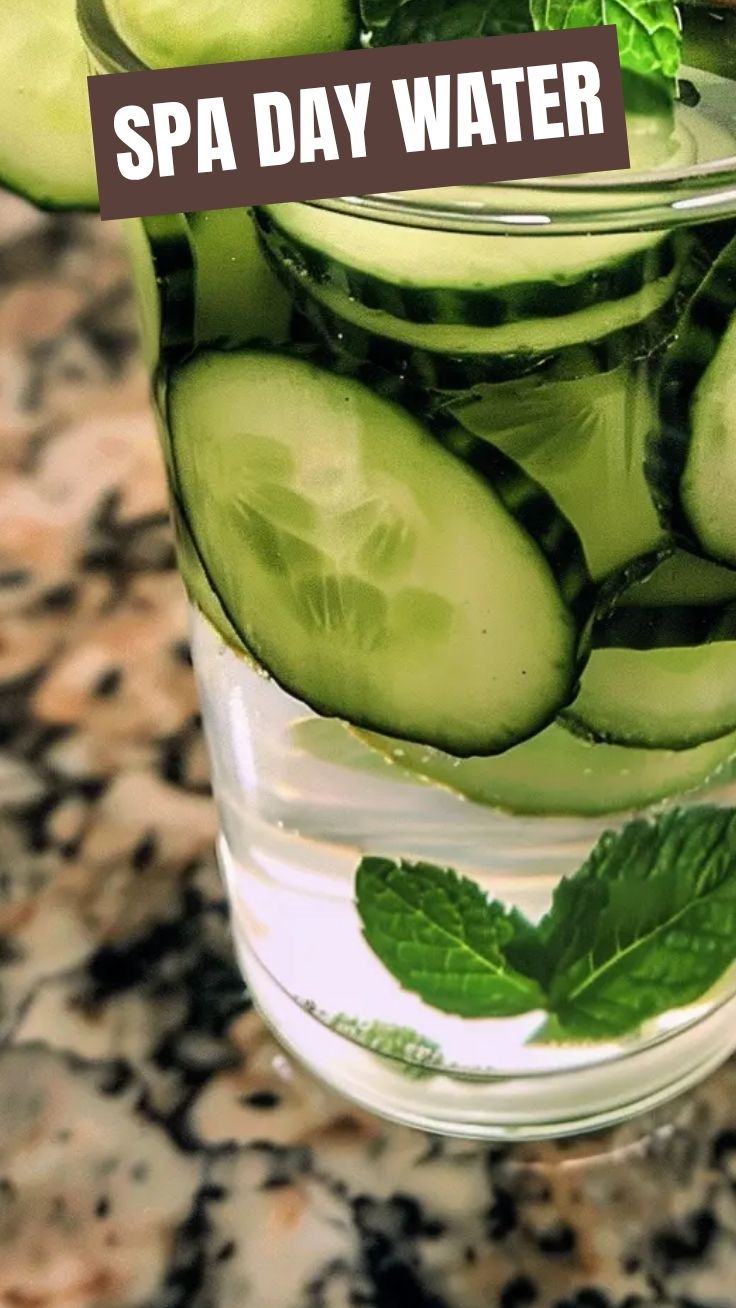 Sparkling cucumber mint infused water in a clear glass pitcher.