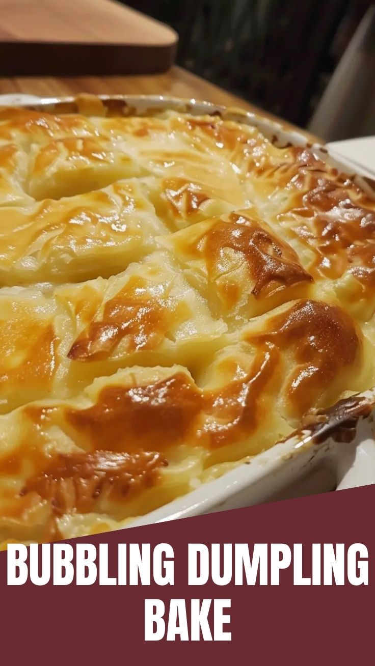 A golden-brown dumpling bake in a ceramic casserole dish