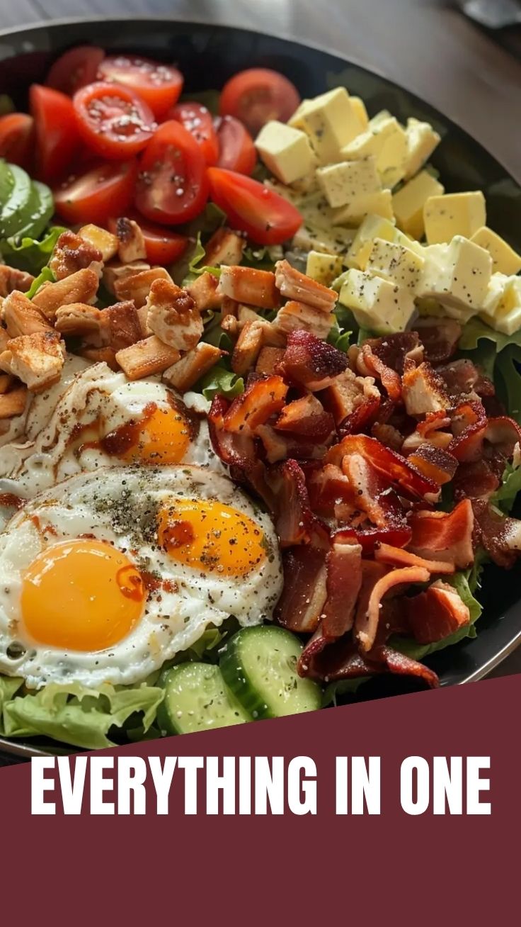 A vibrant Cobb salad with rows of fresh ingredients