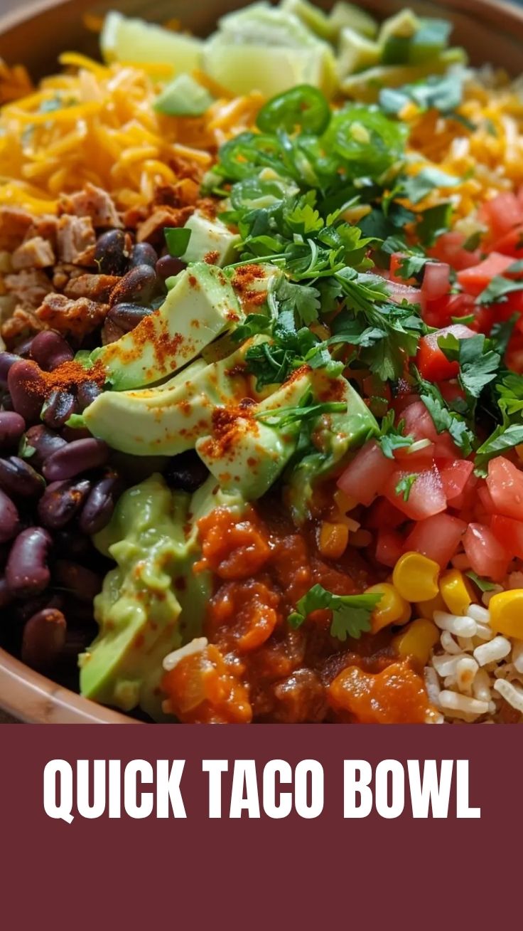 A vibrant taco bowl filled with fresh ingredients like lettuce, corn, and beans.