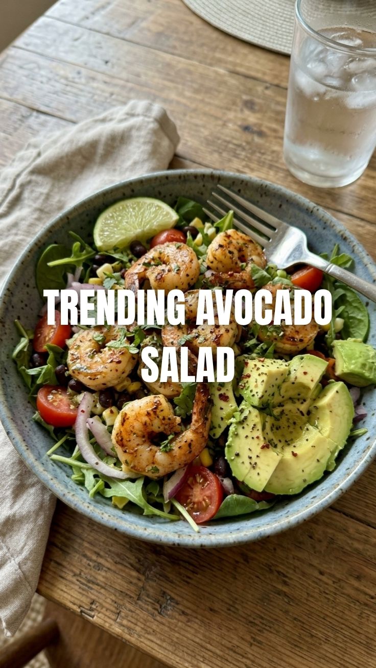 A vibrant bowl of fresh shrimp avocado salad with mixed greens.