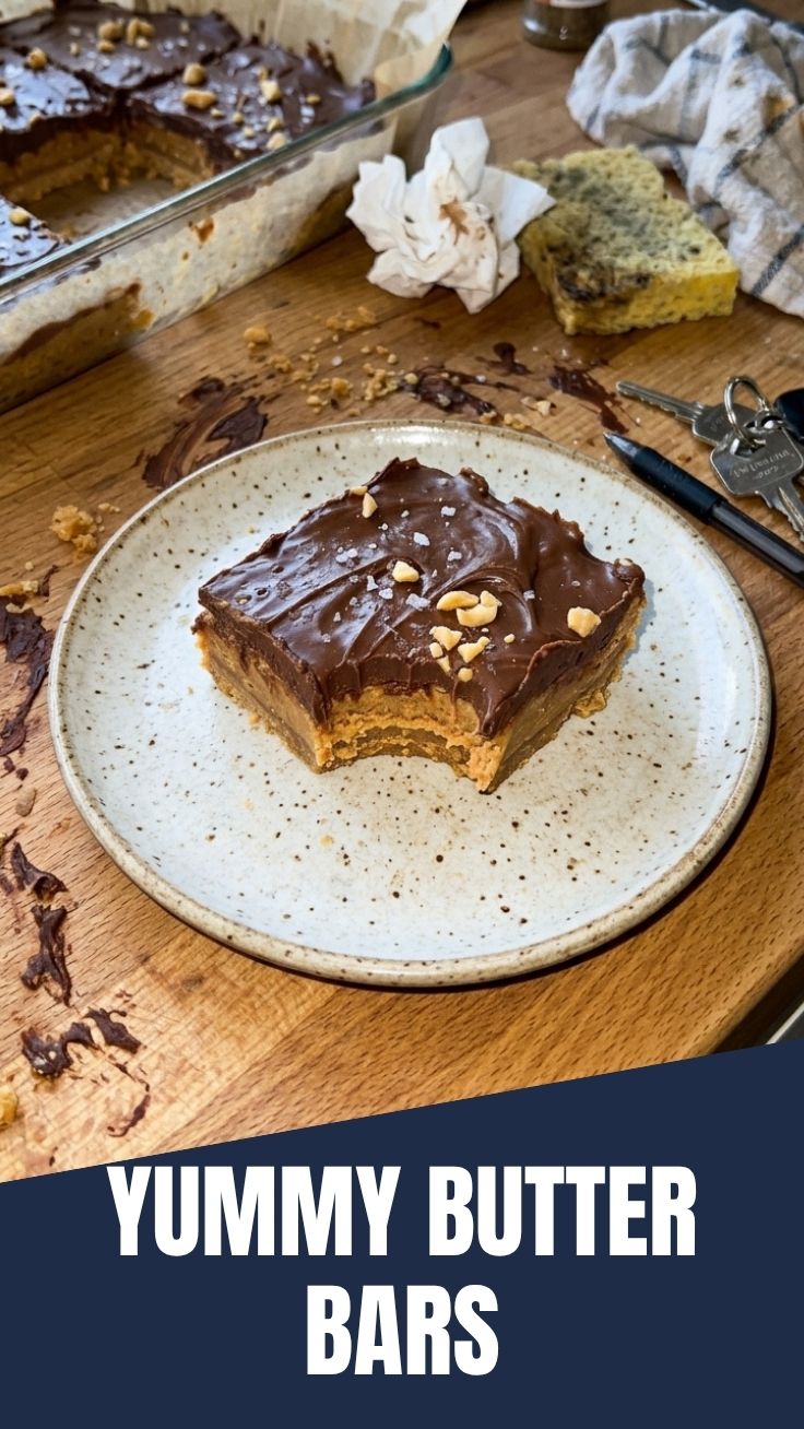 A close-up of delicious no-bake peanut butter bars in a pan, ready to be cut.