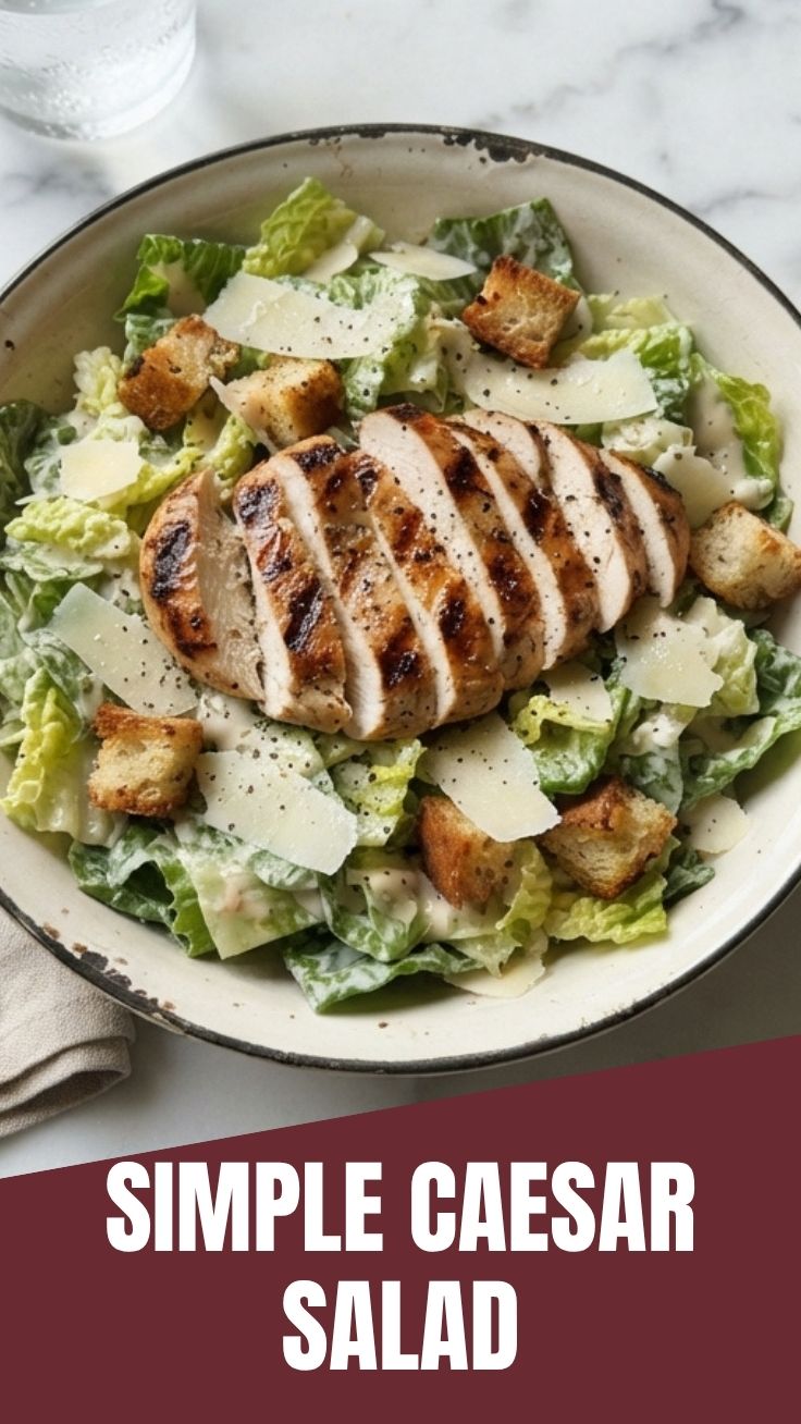 A vibrant chicken Caesar salad with crisp lettuce and croutons.