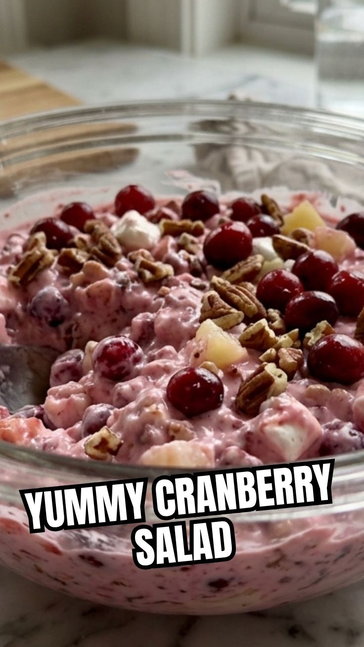 A bowl of fresh cranberry salad with mixed greens.